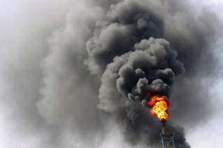 Fire and smoke are seen at a oil refinery in Lanzhou, capital of northwest CHina's Gansu province