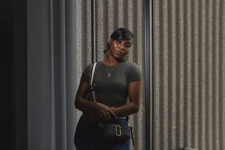 Porcha Woodruff, 32, the first woman known to be wrongfully accused as a result of facial recognition technology, in Oak Park, Mich., Aug. 5, 2023. (Nic Antaya/The New York Times)