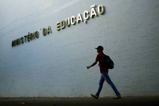 A man walks near the Ministry of the Education building in Brasilia