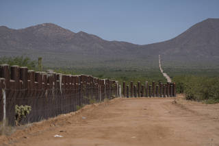 The fence at the U.S.-Mexico border on the Tohono O?odham Nation near Sells, Ariz., on June. 24, 2023. (Rebecca Noble/The New York Times)