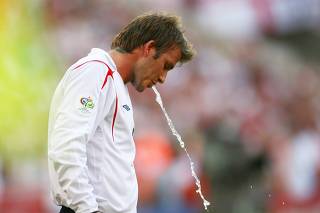 England's Beckham spits out water during Group B World Cup 2006 soccer match against Paraguay in Frankfurt
