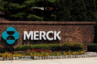 FILE PHOTO: The Merck logo is seen at a gate to the Merck & Co campus in Rahway, New Jersey