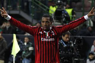 AC Milan's Robinho celebrates after scoring against Arsenal during their Champions League last 16 first leg soccer match at the San Siro Stadium in Milan