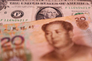 FILE PHOTO: Illustration shows U.S. dollar and Chinese Yuan banknotes