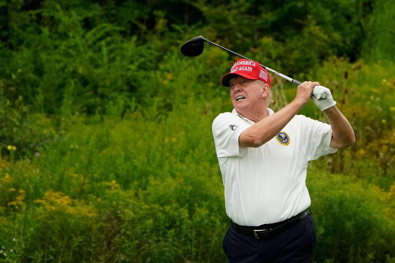 Former US President and 2024 Presidential hopeful Donald Trump plays golf at Trump National Golf Club Bedminster in Bedminster, New Jersey