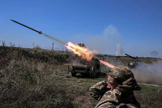 Ukrainian servicemen fire small MLRS toward Russian troops near a front line in Zaporizhzhia region
