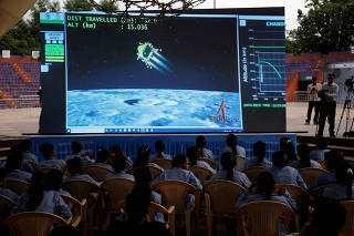 People watch a live stream of Chandrayaan-3 spacecraft's landing on the moon, in Ahmedabad