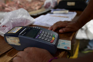 Credit cards grow useless in Venezuela because of sky-high inflation and restrictions
