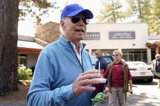 Biden speaks to reporters while on vacation in Lake Tahoe