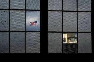 Window panes in a hangar at Camp Justice, Guantanamo Bay Naval Base, in Cuba, Sept. 20, 2021. (Erin Schaff/The New York Times)