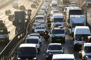 FILE PHOTO: Vehicles sitting in traffic approach the Blackwall Tunnel in London