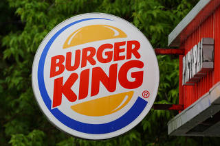 FILE PHOTO: A Burger King logo is seen outside a restaurant in Moscow