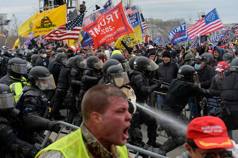 Trump supporters clash with police and security forces as people try to storm the US Capitol in Washington D.C 