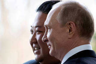 FILE PHOTO: FILE PHOTO: Russian President Vladimir Putin and North Korea's leader Kim Jong Un meet in Vladivostok in 2019