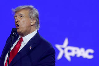 FILE PHOTO: Former U.S. President Donald Trump attends the Conservative Political Action Conference (CPAC) at Gaylord National Convention Center in National Harbor, Maryland