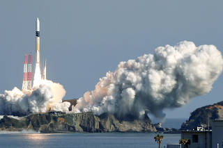 A H-IIA rocket carrying the satellites lifts off from the launching pad at Tanegashima Space Center in Tanegashima