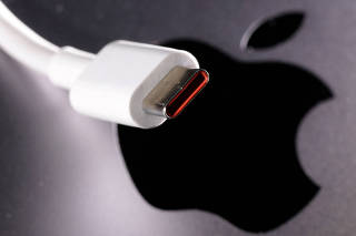 FILE PHOTO: Illustration shows USB-C cable and Apple logo