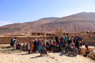 Earthquake survivors wait for aid in the village of Ighil Ntalghoumt