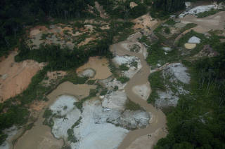 An airplane is seen within an area of illegal gold mining after a removal operation by security forces and agencies of the Brazilian government in the Yanomami indigenous land