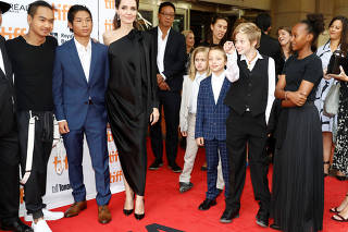 Jolie arrives on the red carpet with her children or the film 