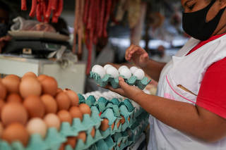 FILE PHOTO: Shopping at a weekly street market in Rio de Janeiro