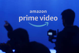 FILE PHOTO: Media are seen in front of an Amazon Prime Video logo during an Amazon Prime Video India launch event in Mumbai