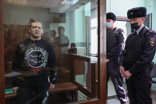Russian opposition activist Dmitry Ivanov attends a court hearing in Moscow