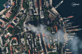 Satellite imagery shows smoke billowing from a Russian Naval HQ after Ukrainian strike