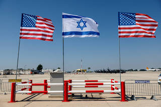 FILE PHOTO: Israeli and American flags flutter during preparations for U.S. President Joe Biden's visit to Israel