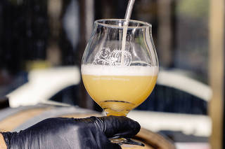 A test pour of Sonoran Mist, a German style helles lager made with treated wastewater, at the Desert Monks Brewing Company, in Gilbert, Ariz., May 26, 2023. (Cassidy Araiza/The New York Times)