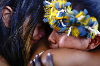 Brazilian Xokleng Indigenous people celebrate after a majority on Brazil's Supreme Court voted against the so-called legal thesis of 'Marco Temporal', in Brasilia