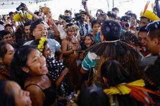 Brazilian Xokleng Indigenous people celebrate after a majority on Brazil's Supreme Court voted against the so-called legal thesis of 'Marco Temporal', in Brasilia