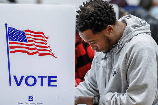 Voters head to the polls on election day in Michigan
