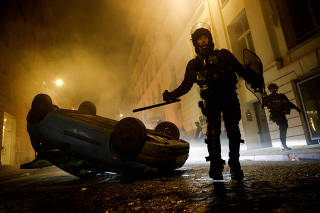 FILE PHOTO: Fifth night of riots after a teenager shot dead by police in Paris suburb