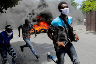 FILE PHOTO: People protest for an end to gang violence, in Port-au-Prince