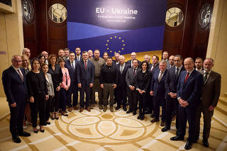 Ukraine's President Zelenskiy and EU foreign ministers pose for a picture during a meeting in Kyiv