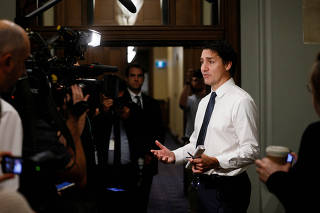 Canada's Prime Minister Justin Trudeau speaks to media outside his office on Parliament Hill in Ottawa