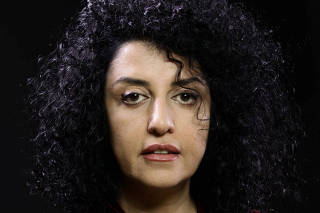 Iranian human rights activist and the vice president of the DHRC Narges Mohammadi poses