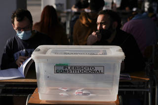 Chileans vote in a mandatory plebiscite to approve or reject the new Constitution