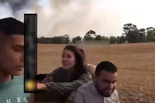 A screengrab from a social media video published on October 7, 2023 shows Noa Argamani as she is taken hostage by Palestinian militants
