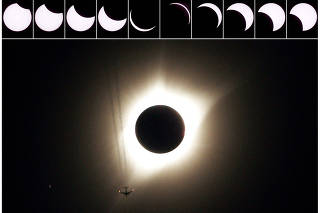 FILE PHOTO: A combination of ten pictures shows the progression of a partial solar eclipse near as a jet plane flies by the total solar eclipse in Guernsey