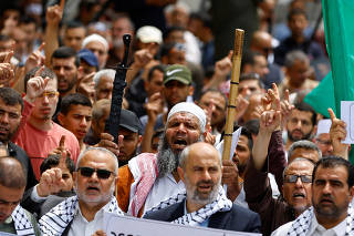 Palestinian Hamas supporters attend a rally against visits by Israeli right wing groups to Al-Aqsa mosque, in Khan Younis