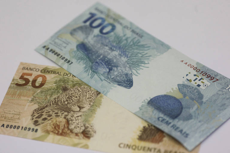 Imagem mostra duas notas, uma de 100 e outra de 50 reais