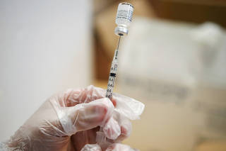 FILE PHOTO: Senior citizens receive vaccinations against coronavirus disease in Evanston