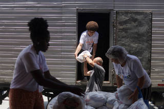 FILE PHOTO: A solidarity fundraising campaign donates food to poor families, in Rio de Janeiro