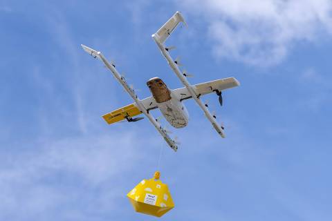 (FILES) In this file photo taken on August 31, 2022 A drone secures an order before flying from Wing facility during a demonstration in Frisco, Texas on August 31, 2022. - A handful of firms already have operations running or will by year's end in parts of Texas, North Carolina or California, with providers including Israeli startup Flytrex, Wing and e-commerce behemoth Amazon.
In fact, it was Amazon founder Jeff Bezos who in 2013 unveiled a delivery drone in a CBS interview, predicting that within five years airborne shipments would be routinely zipping from fulfillment centers to customers' doorsteps. (Photo by Andy JACOBSOHN / AFP)