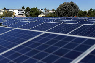 FILE PHOTO: Solar panels are shown at a housing project in National City, California