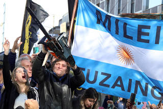 FILE PHOTO: Argentine presidential candidate Javier Milei meets supporters during a campaign rally, in Buenos Aires