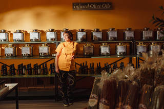 Michelle Spangler at Infused Oils & Vinegars in Dallas on Tuesday, Oct. 10, 2023. (Zerb Mellish/The New York Times)