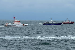 Rescue ships search for survivors following a ship collision in the North Sea near the German island of Helgoland